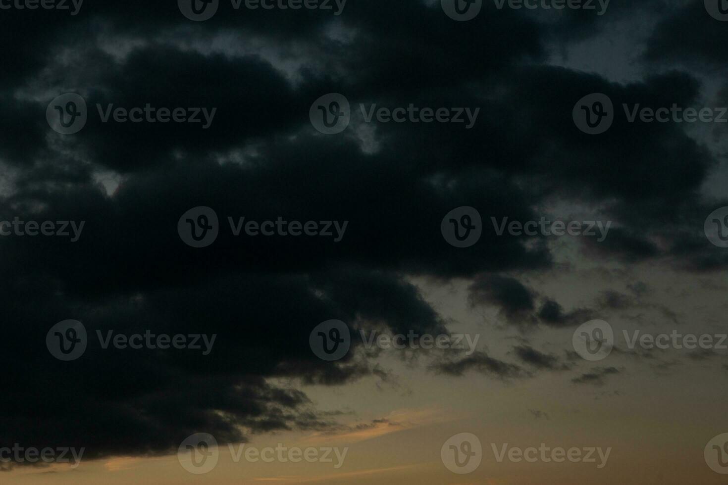 Stormy sky with dark clouds. Natural background. Sky background. Cloudscape, Colored Sunset. photo