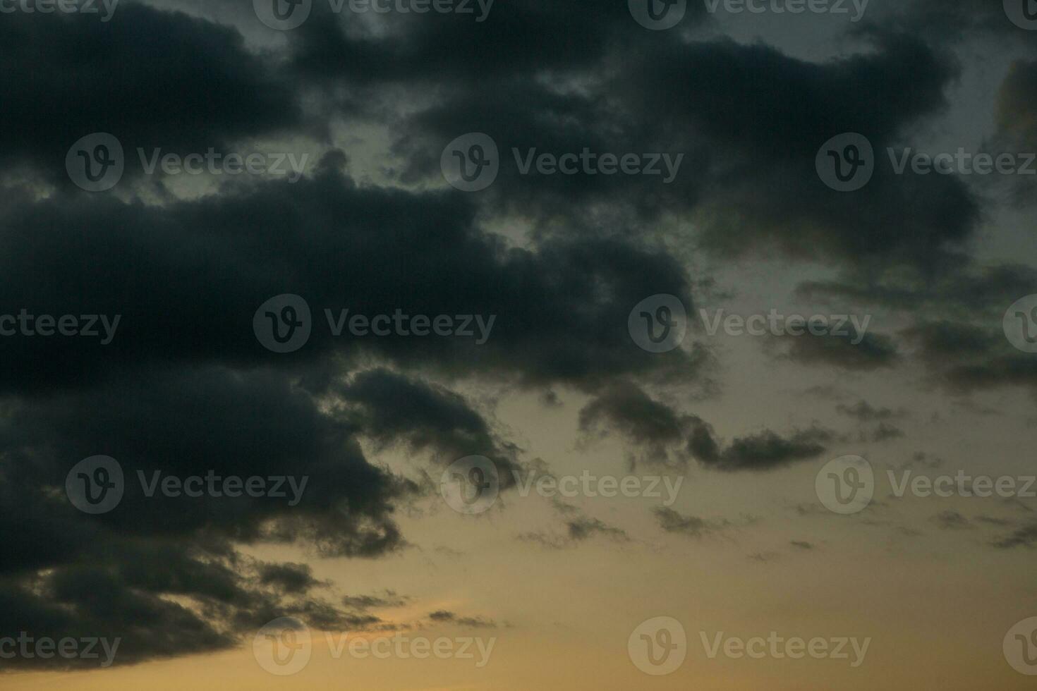 Stormy sky with dark clouds. Natural background. Sky background. Cloudscape, Colored Sunset. photo