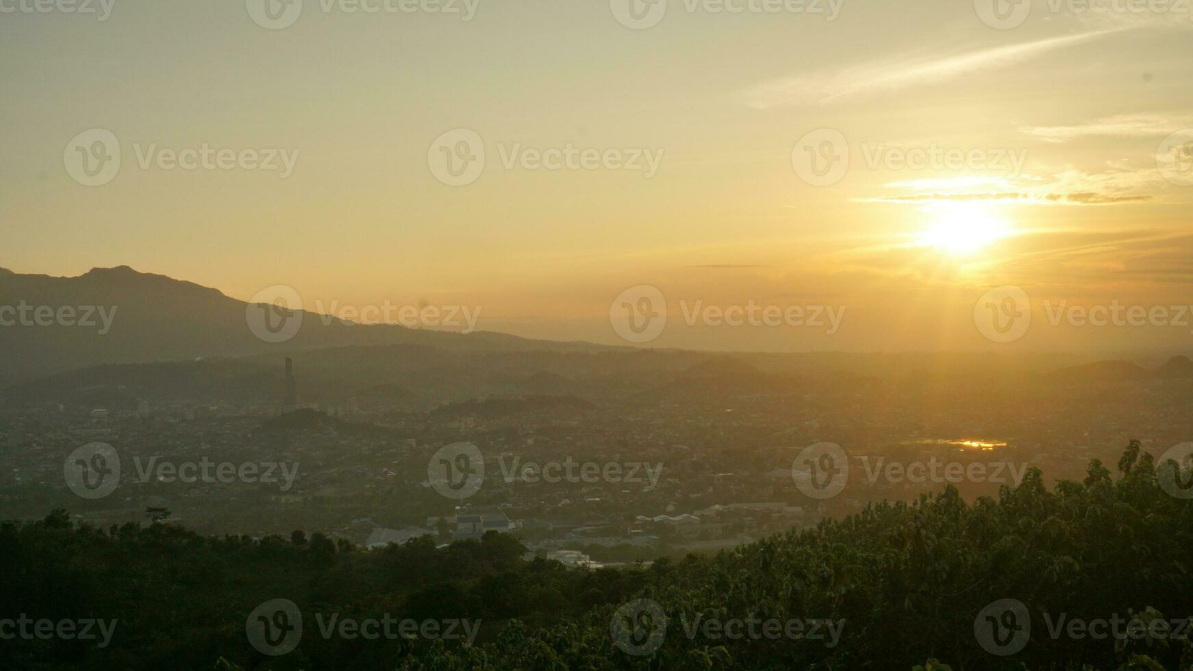 Sunset view with sky, cloud, Rajabasa mountain in Lampung view from Bukit Aslan or Aslan hill photo