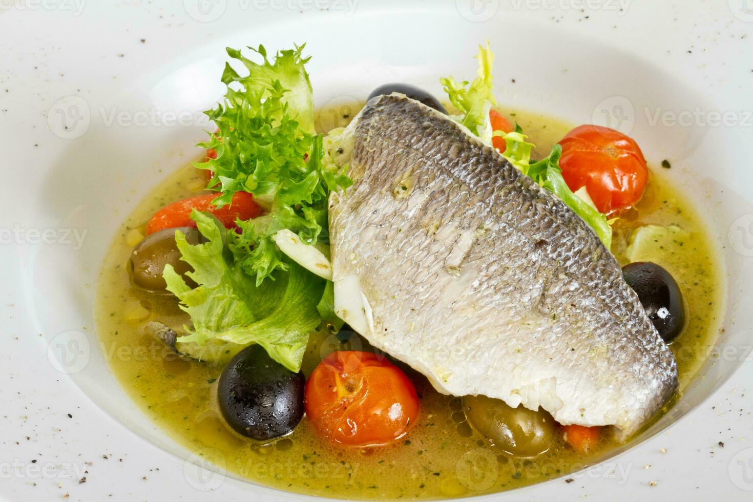 Fish soup with dorado and vegetables photo