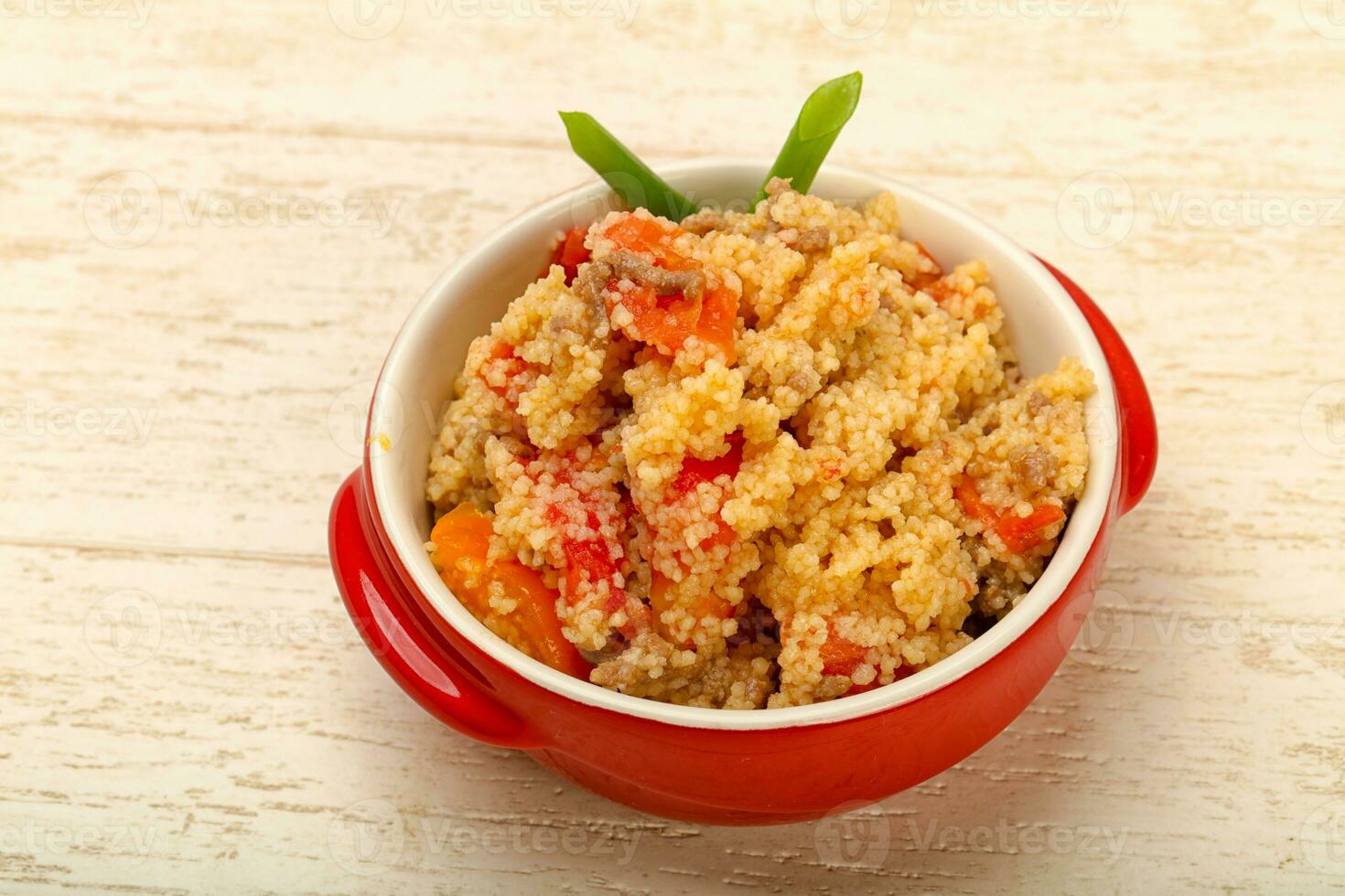 Couscous with meat in the bowl photo