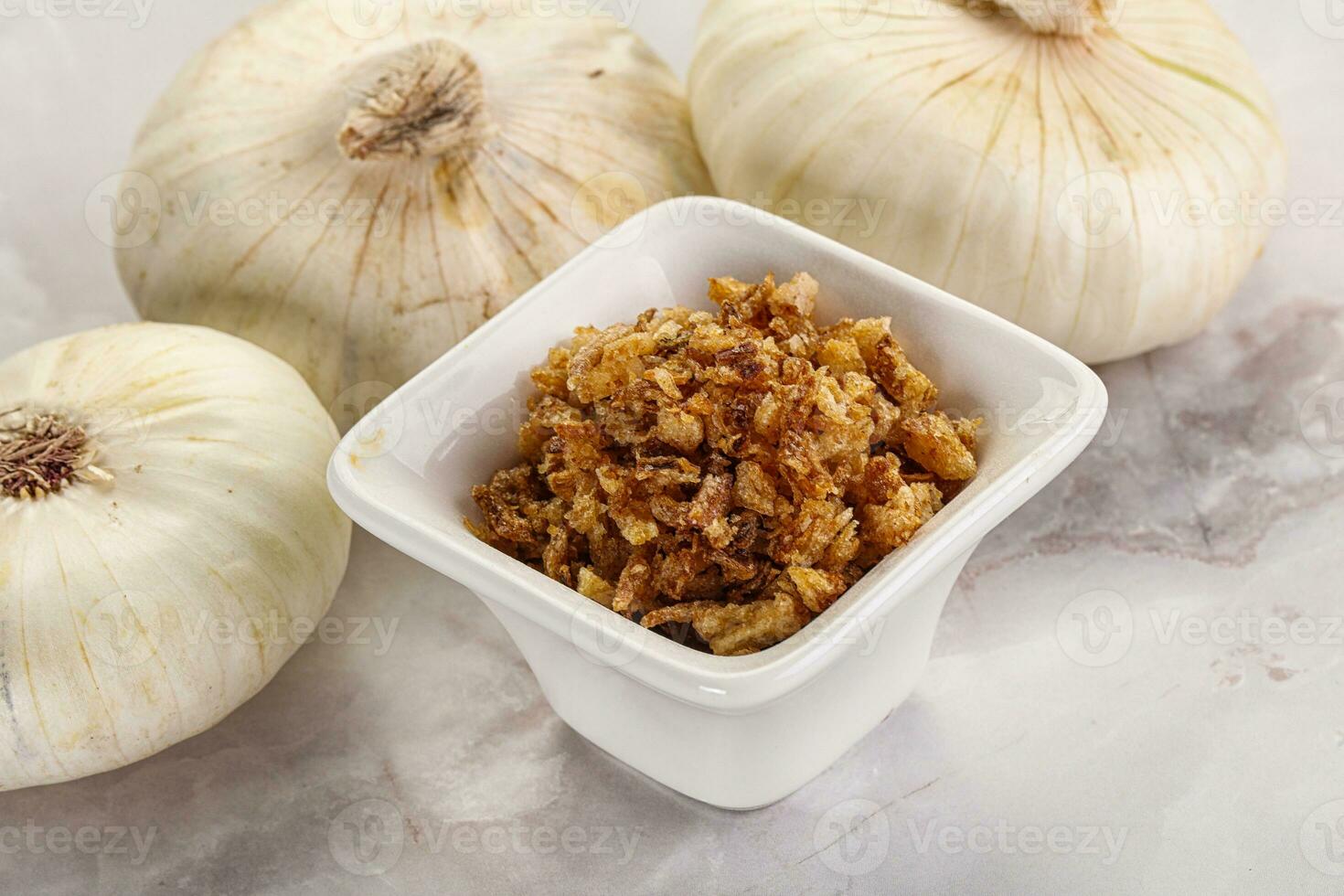 Dried roasted onion flakes for culinary photo