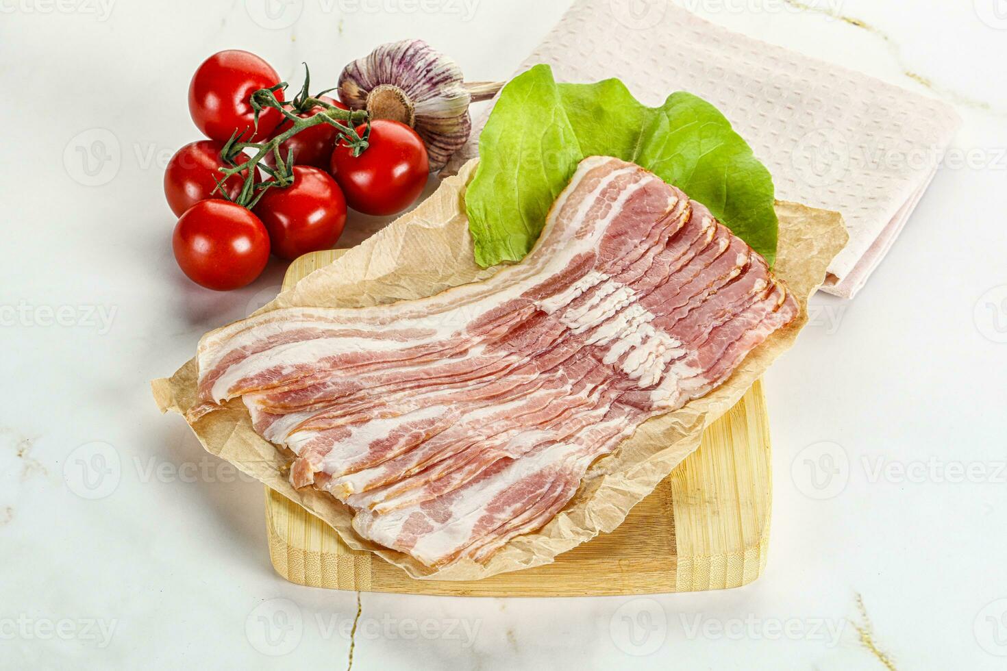 Sliced pork bacon oved board photo