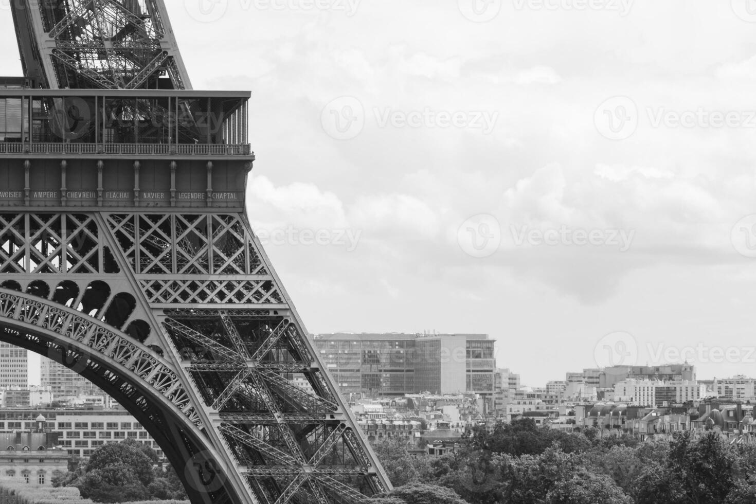 black and white photo of detail of Eiffel Tower in Paris