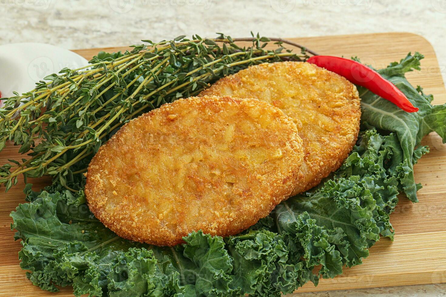 Fried crusty potato hashbrown pancake photo