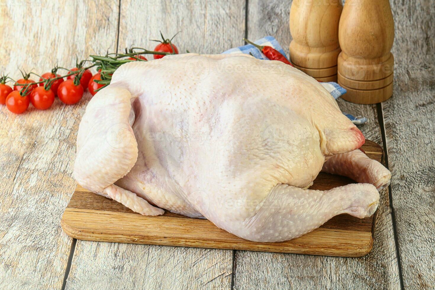Whole raw chicken for cooking 34060010 Stock Photo at Vecteezy