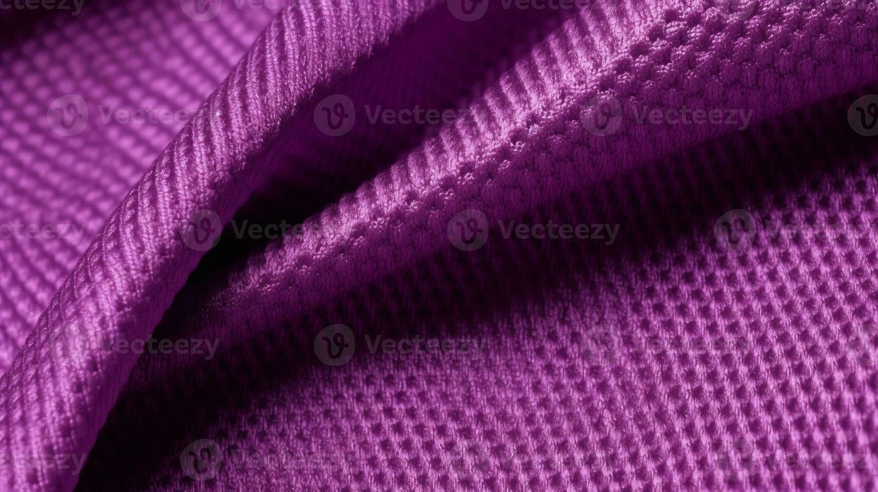 Purple soccer fabric texture with air mesh. Sportswear background photo