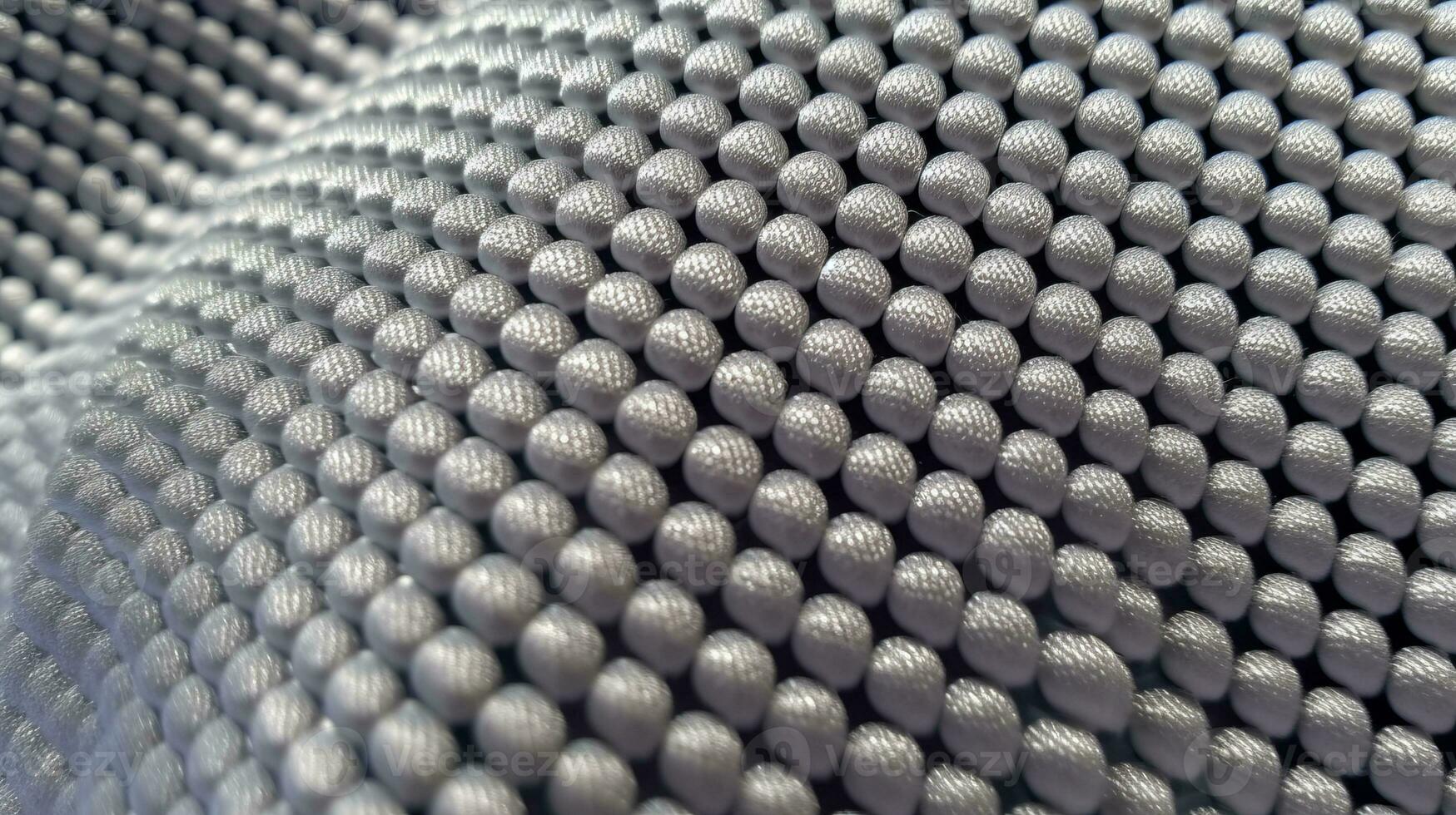 Grey soccer fabric texture with air mesh. Sportswear background photo