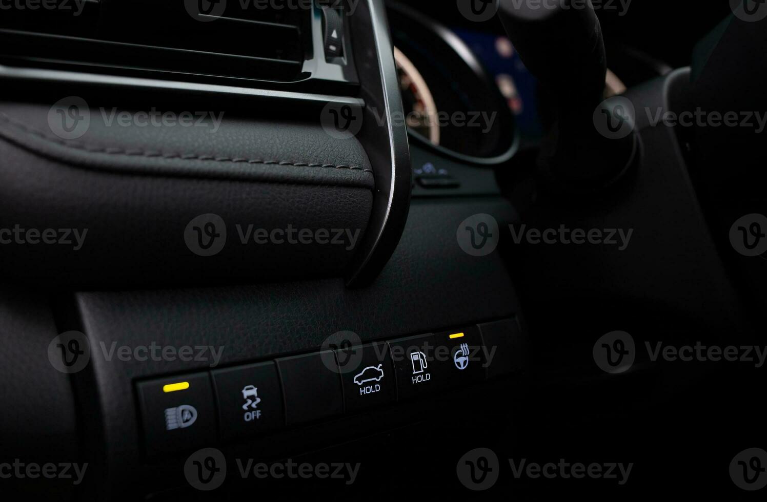 Car buttons on a control panel background, car elements close view photo