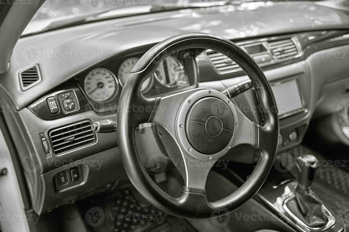 Car steering wheel and car sensors, inerior background, modern city car elements close view. Car inside interior photo