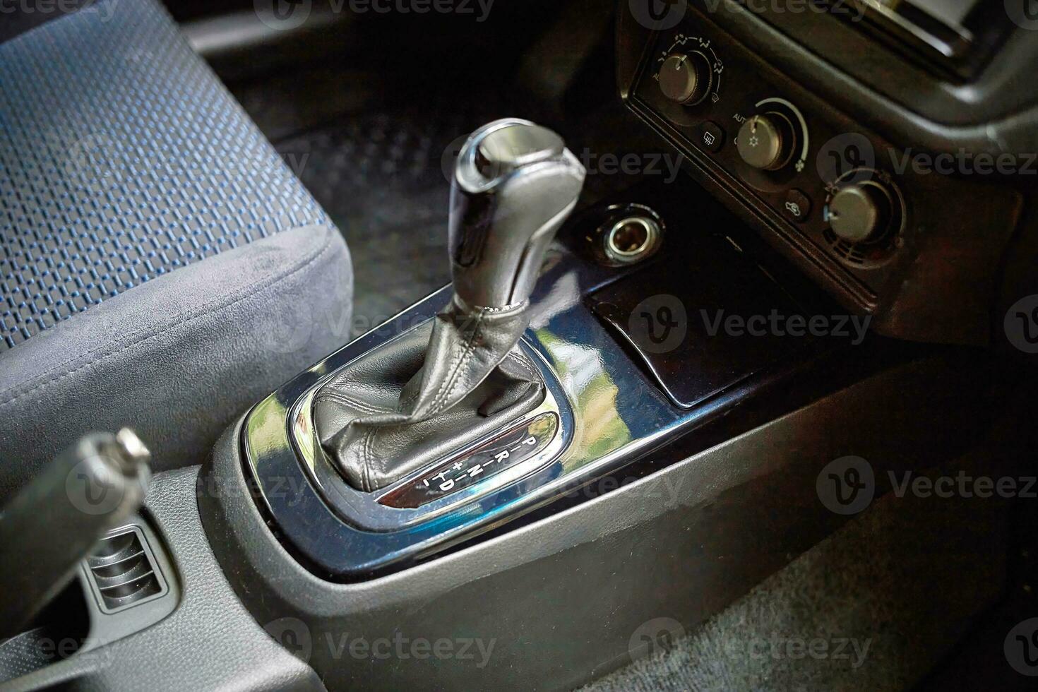 Car shift lever. Inside a modern car view, city car interior background photo