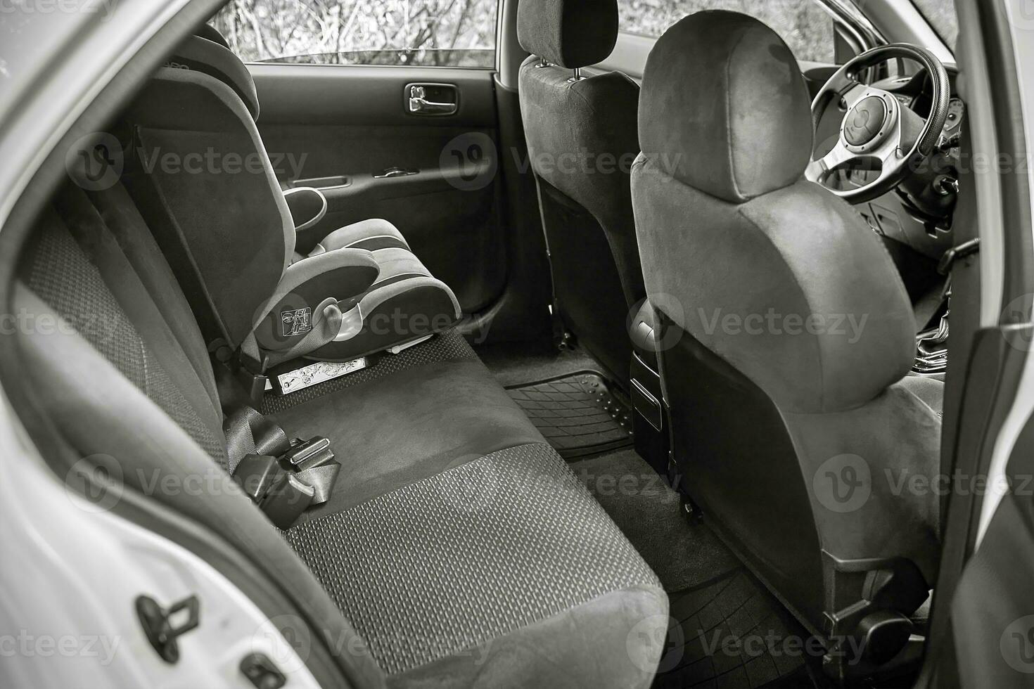 Child car chair inside the car. City car seat and interior photo