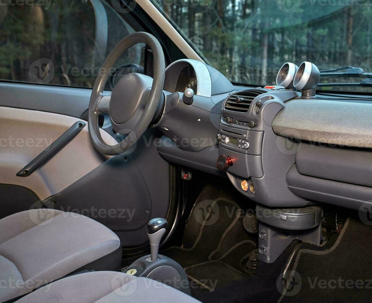 Car steering wheel and interior background, modern city car elements close view. Car inside interior photo