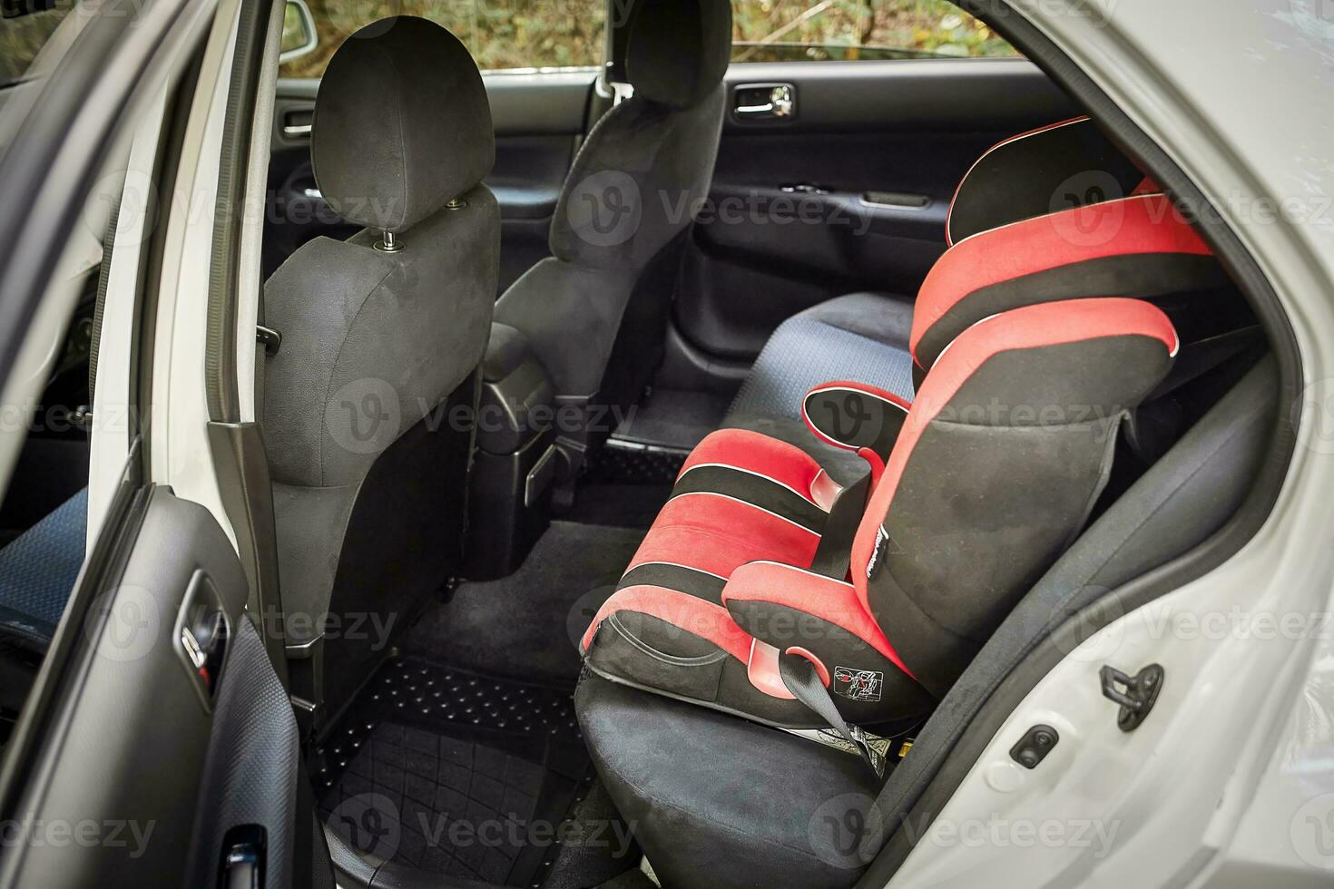 Child car chair inside the car. City car seat and interior photo