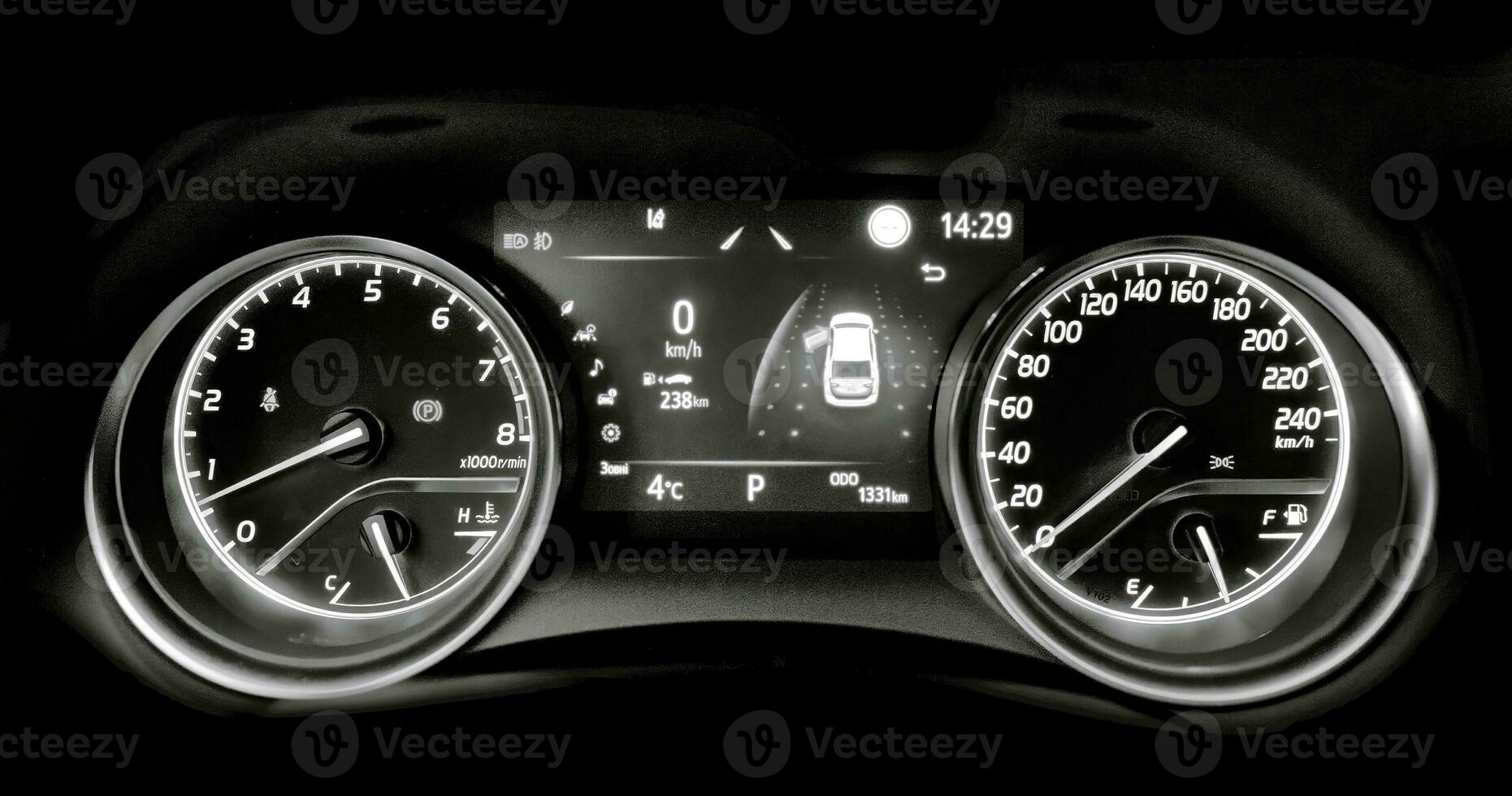Car speedometer and sensors on a control panel background, car elements close view photo