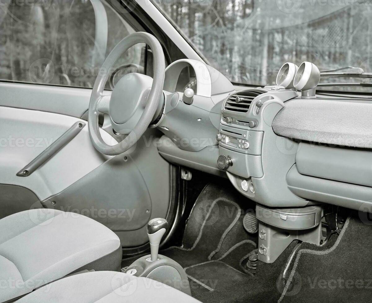 Car steering wheel and interior background, modern city car elements close view. Car inside interior photo