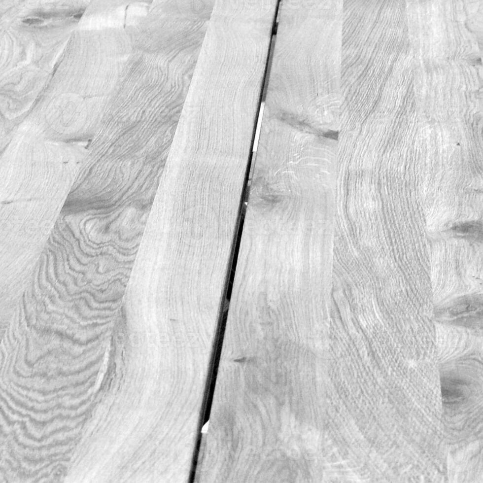 Natural wood black and white background with blurred elements. Monochrome wooden surface pattern, grayscale wood texture photo