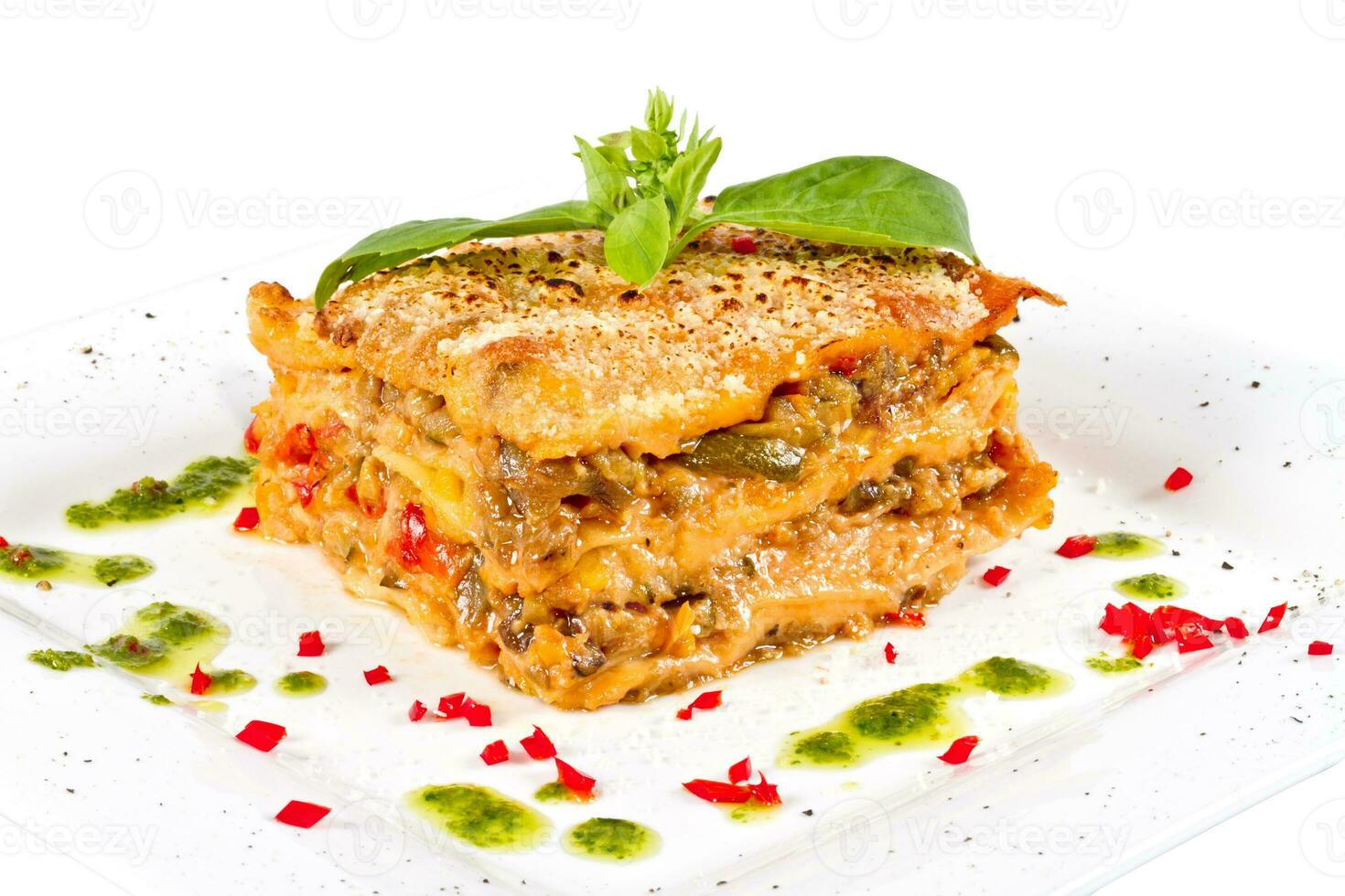 Closeup of lasagna and basil fork photo