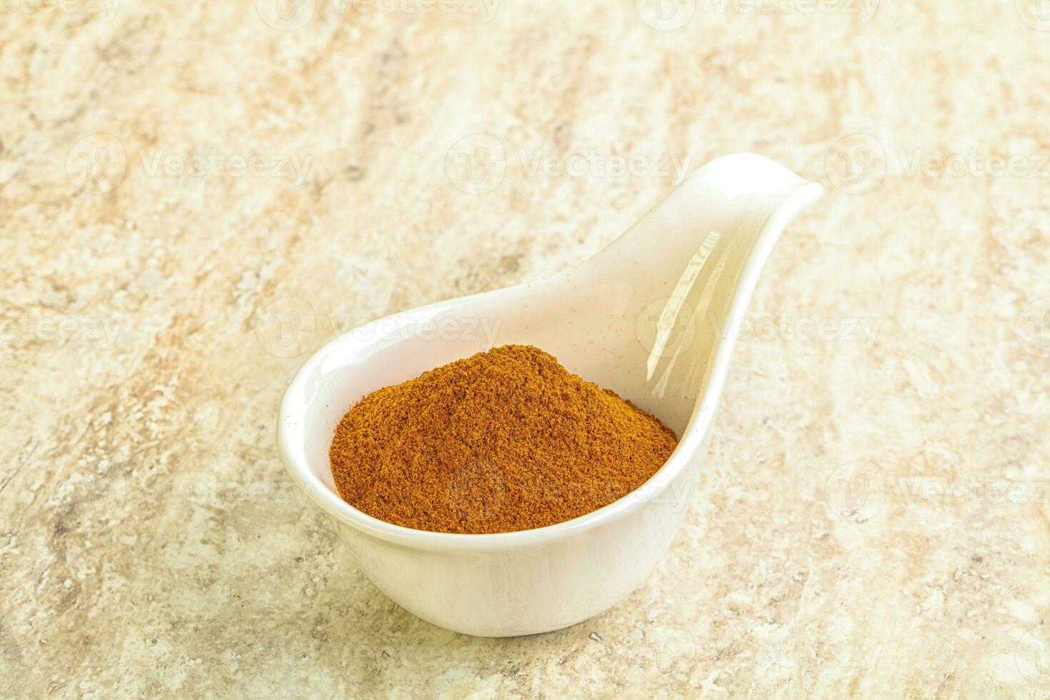 Dry Paprika powder in the bowl photo