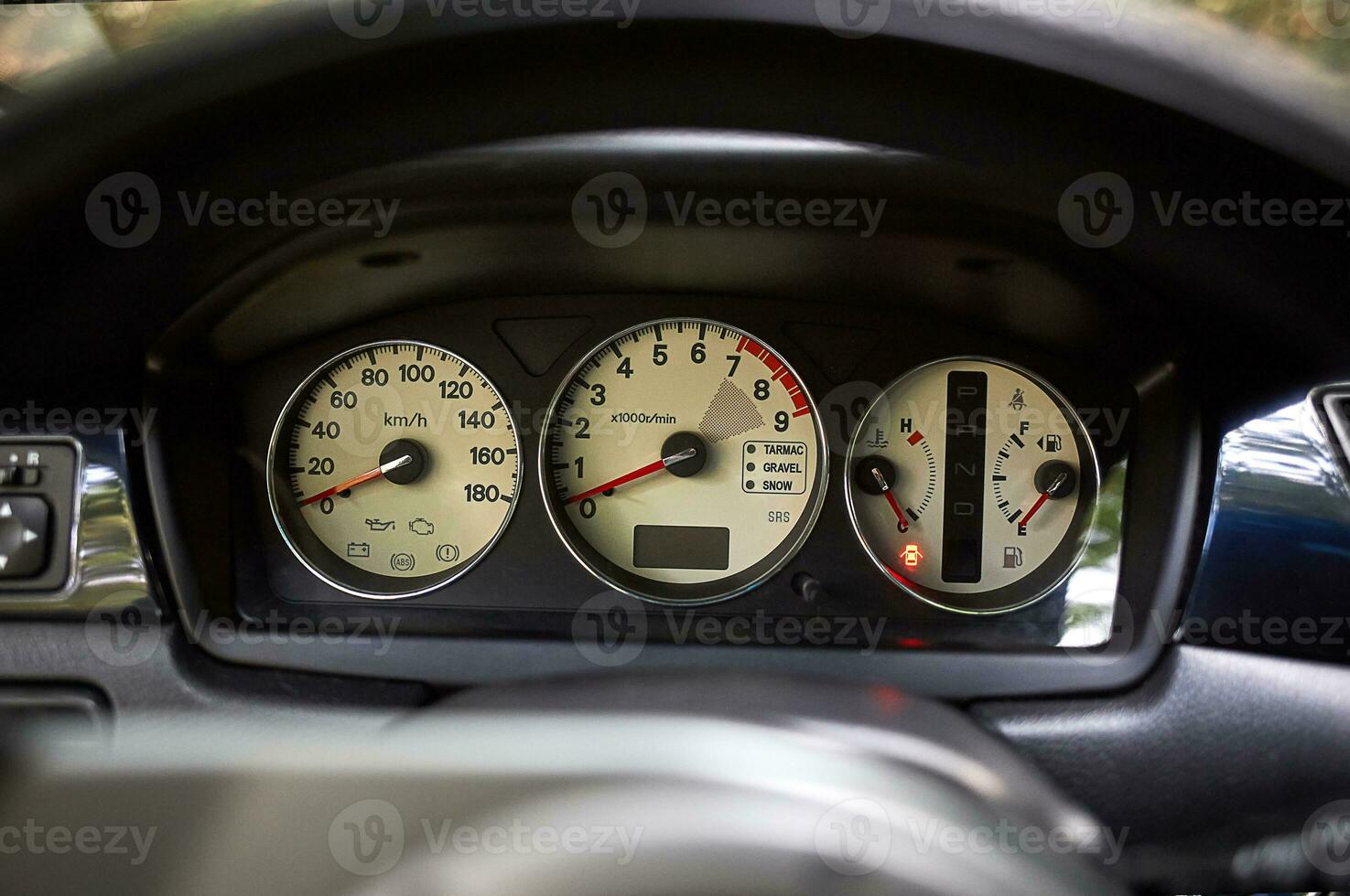 Car steering wheel and car sensors, inerior background, modern city car elements close view. Car inside interior photo