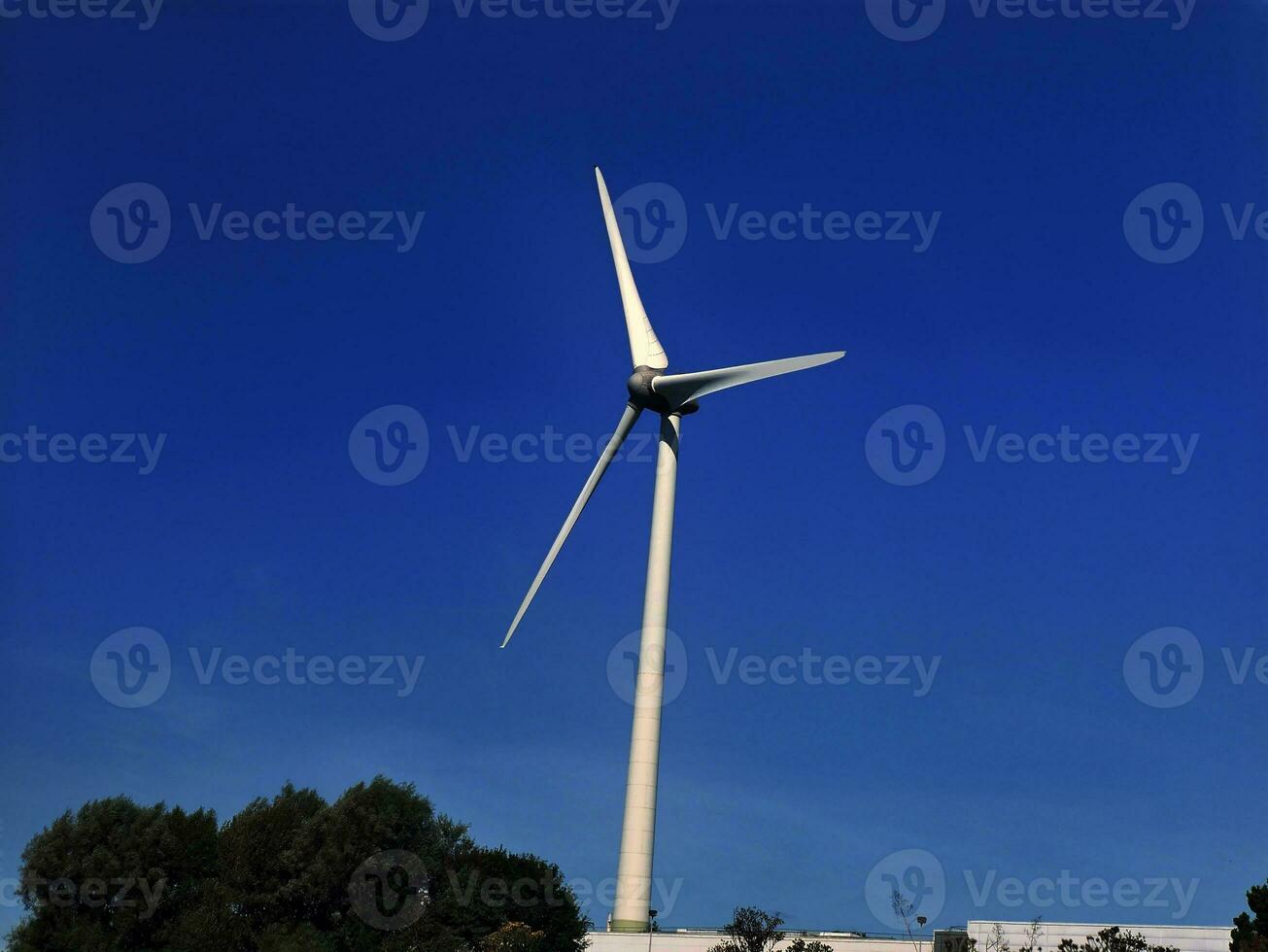 Wind power plant rotor close view. Windpower generator. Green energy, eco friendly industry concept photo