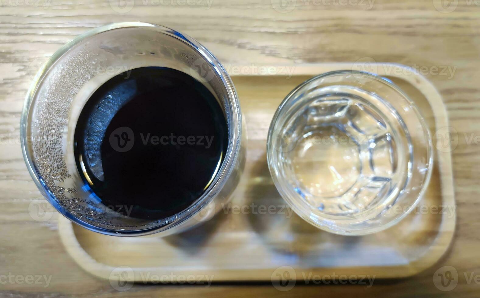 Coffee and water background, black coffee and a glass of water photo