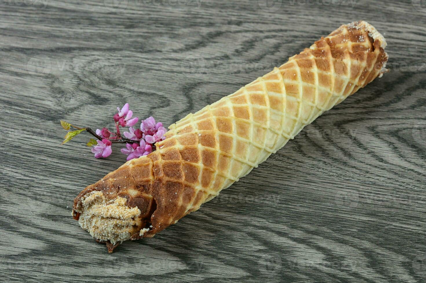 Wafer roll on wooden background photo