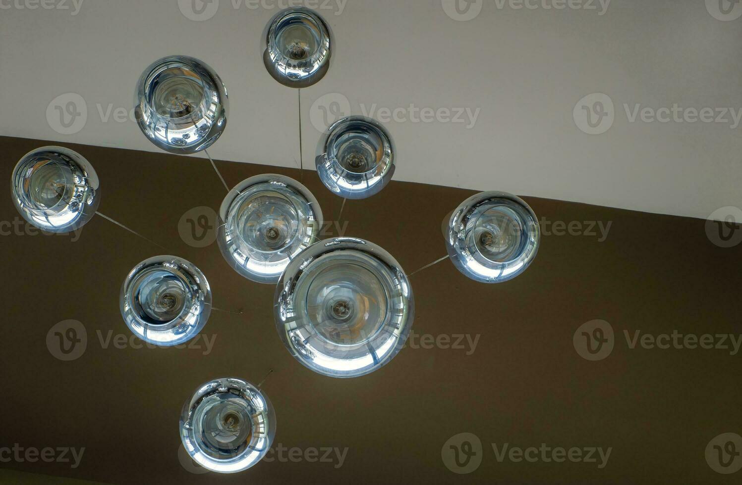 Modern chandelier background, round lamps over ceiling pattern photo