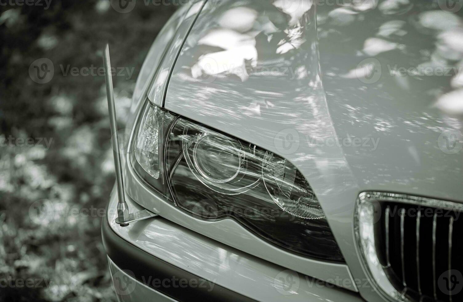 White car with a street background. Modern city car photo