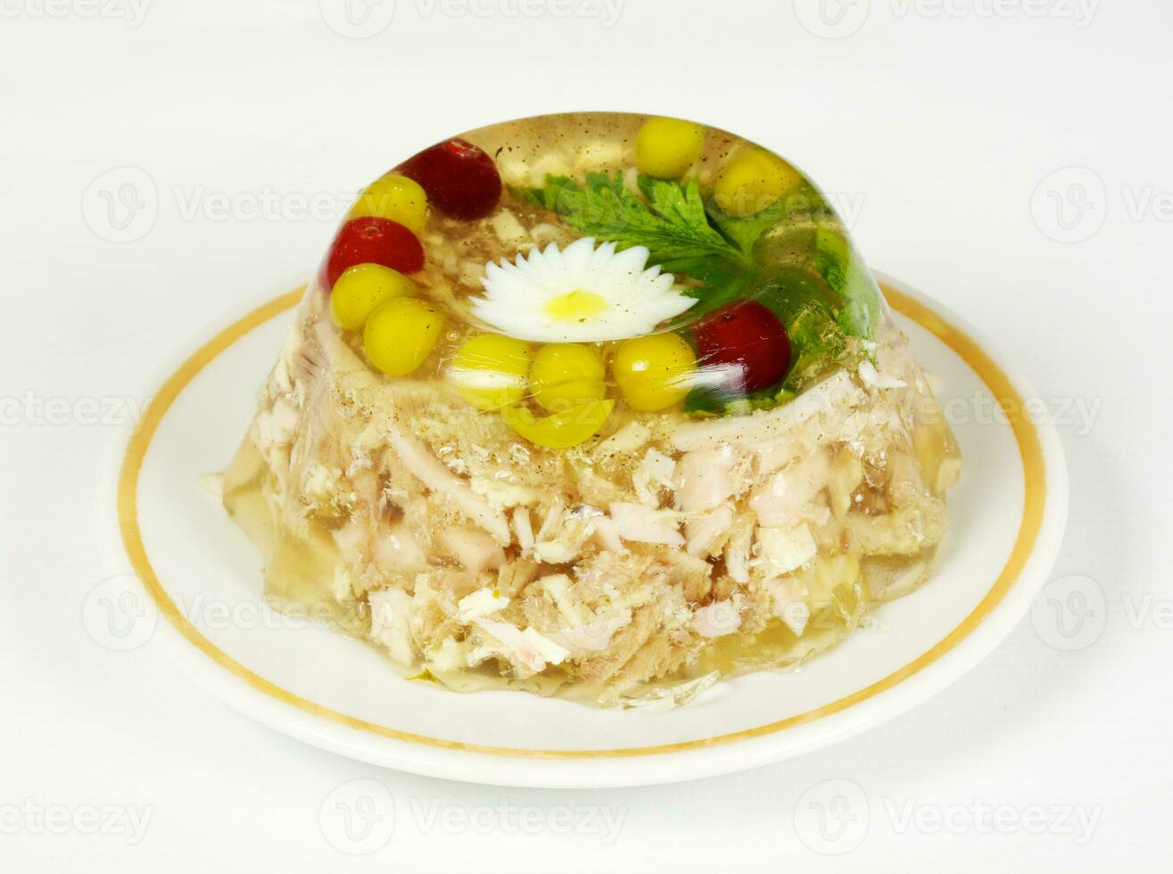 Aspic from chicken meat decorated with eggs and parsley photo