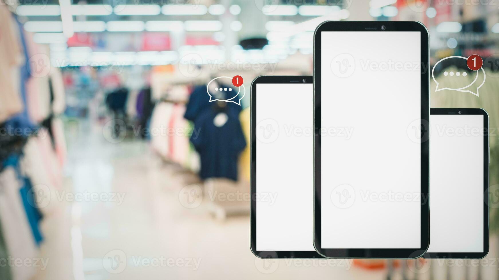 White screen smartphone with message icons isolated on background inside shopping mall. online shopping Website, marketplace platform, e-commerce technology and online payment concepts. photo