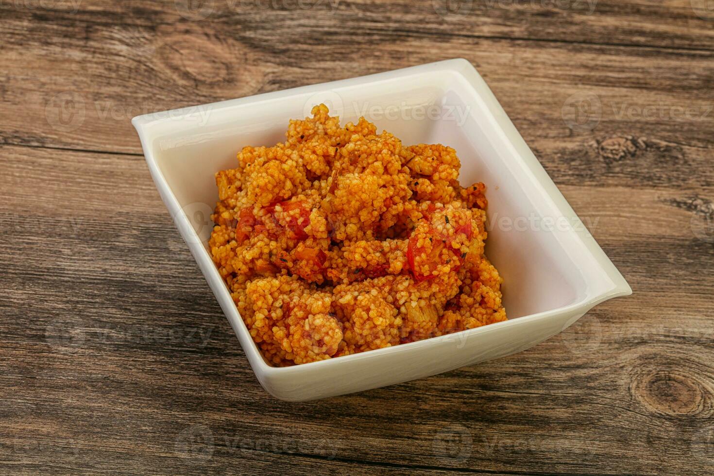 Couscos with tomato and chicken photo