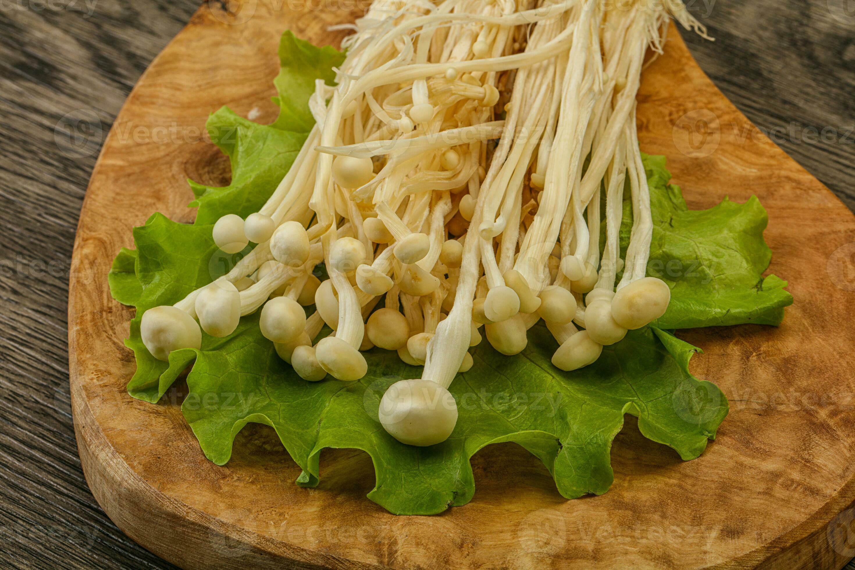 Raw Enoki mushrooms for cooking 34070830 Stock Photo at Vecteezy
