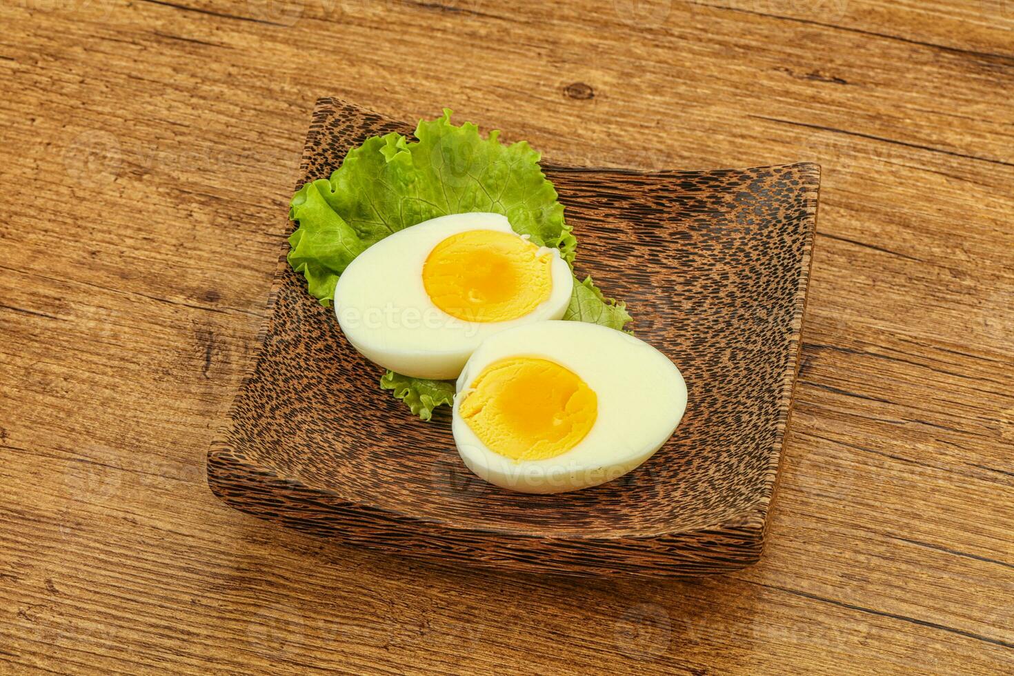 Boiled egg slices in the bowl photo