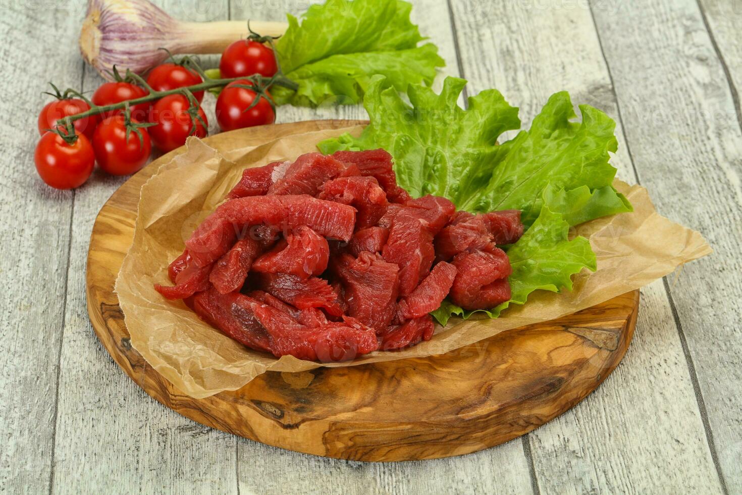 Raw beef meat sliced for cooking photo