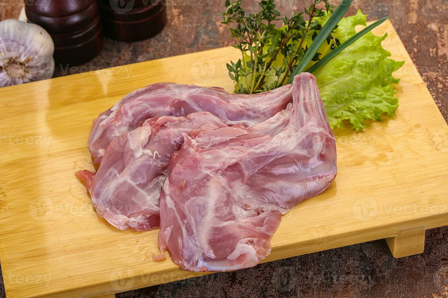 Raw rabbit legs photo