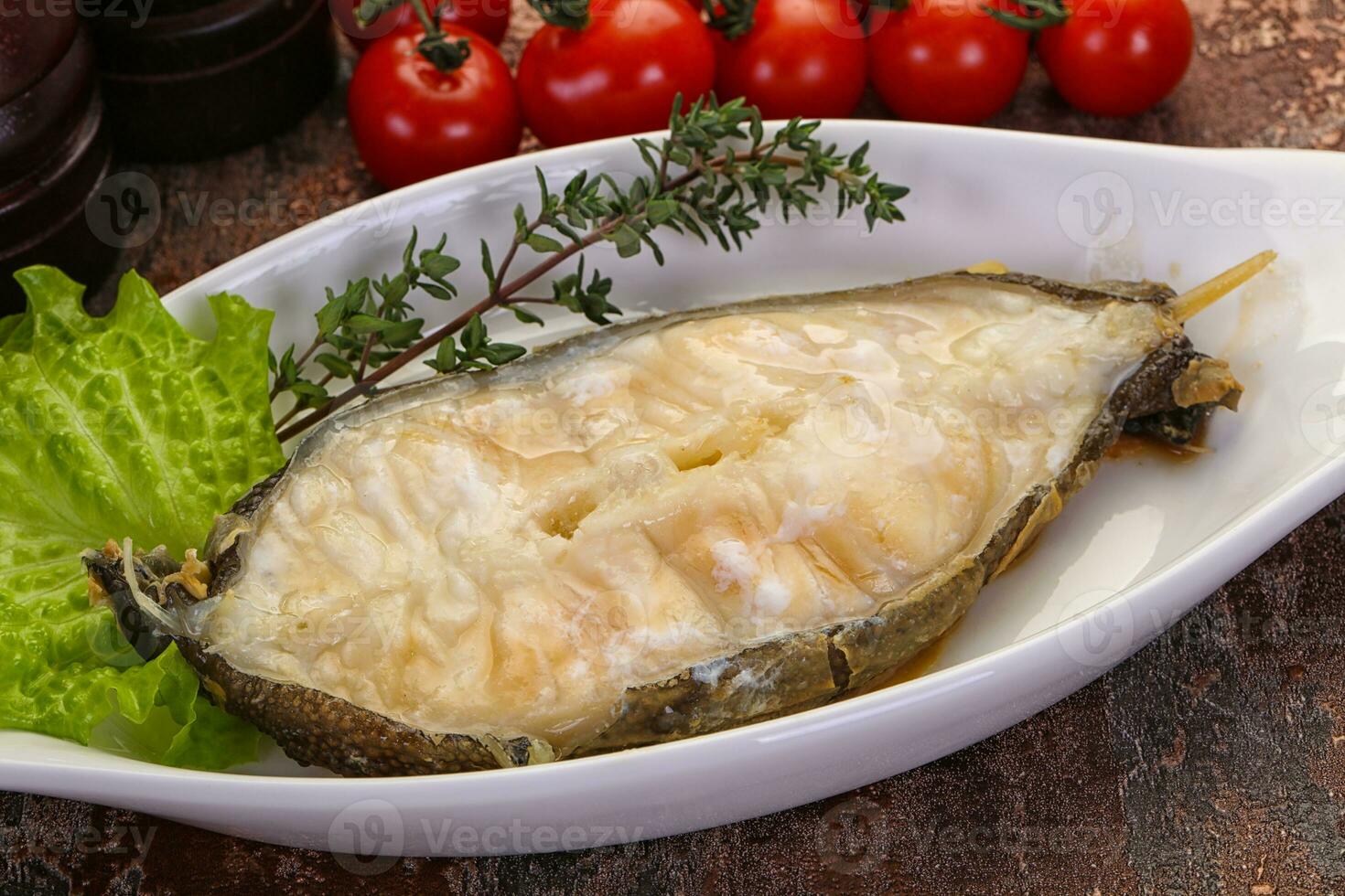 Baked wolffish steak photo