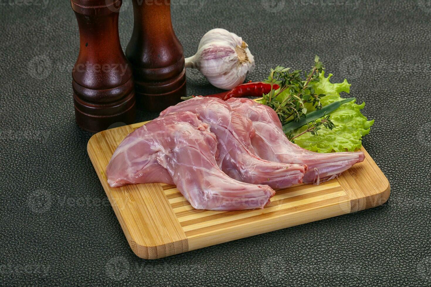 Raw rabbit legs photo