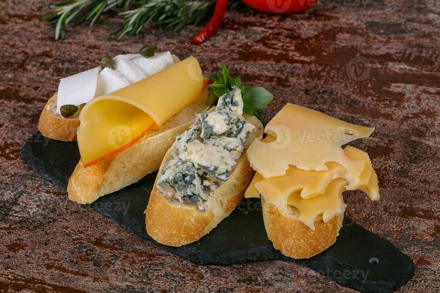 Bruschetta with various cheeses photo