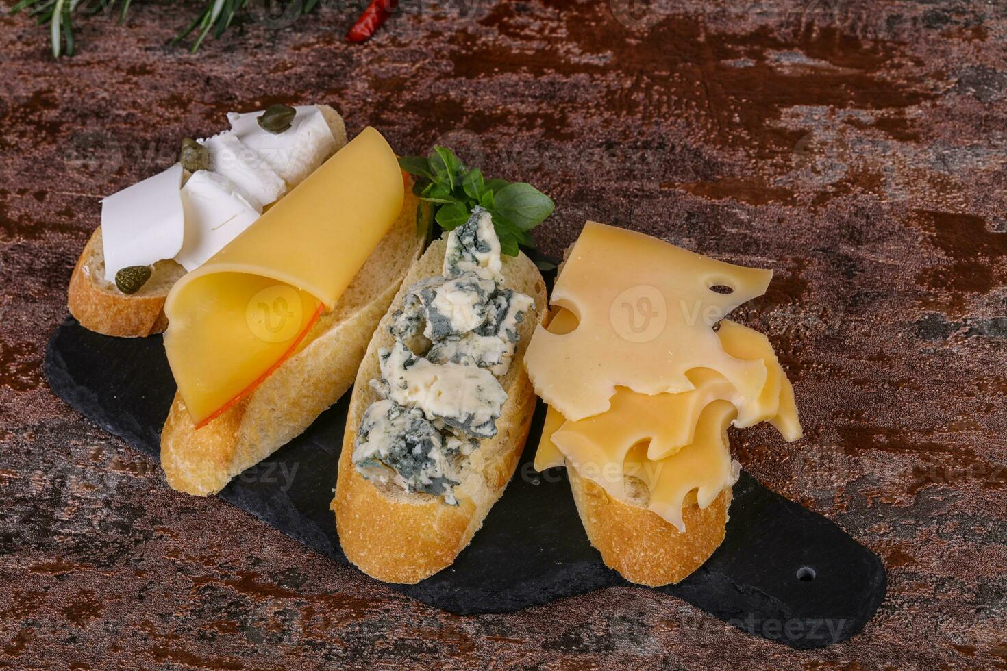 Bruschetta with various cheeses photo