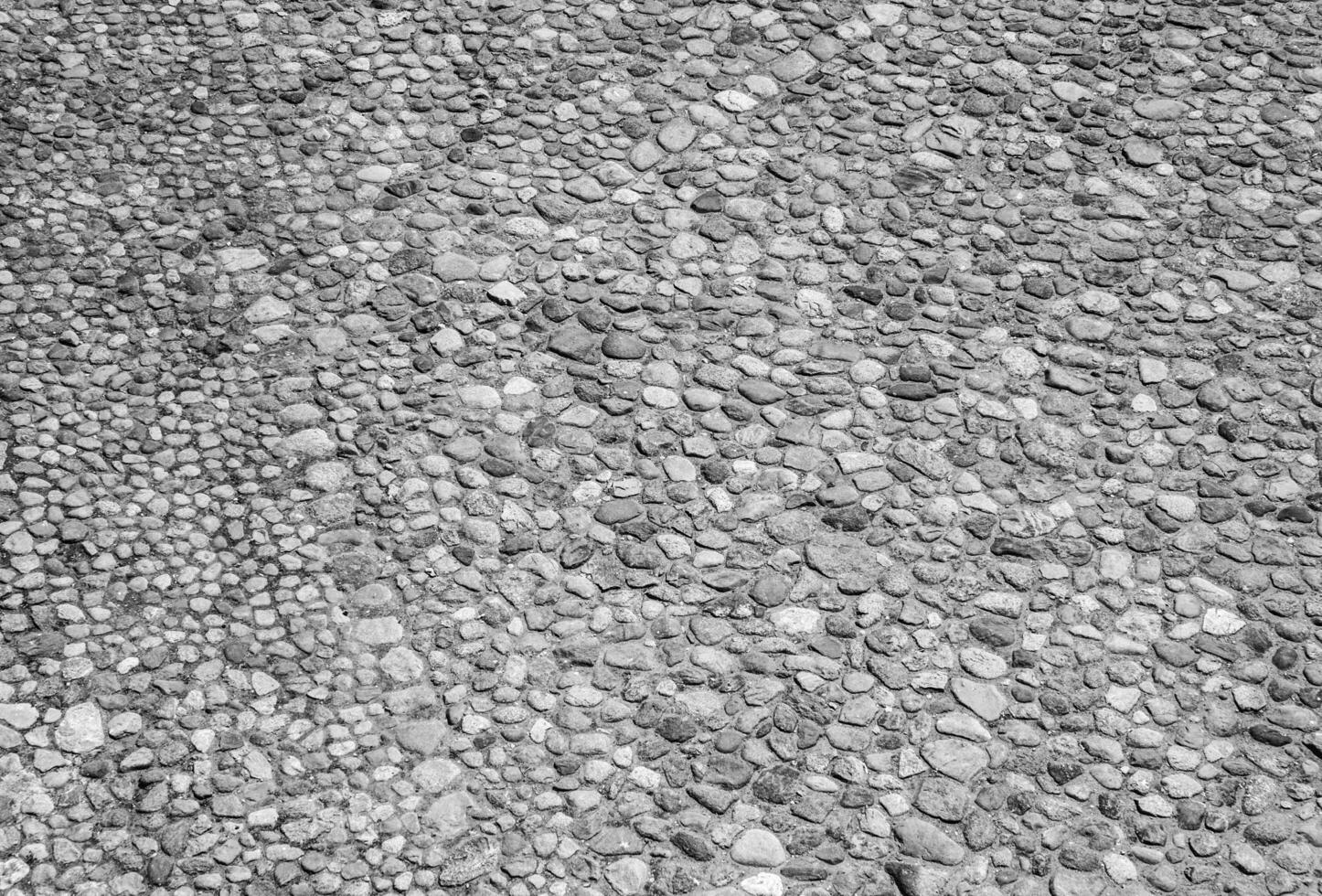 An old stone wall texture, black and white stone pattern surface background photo