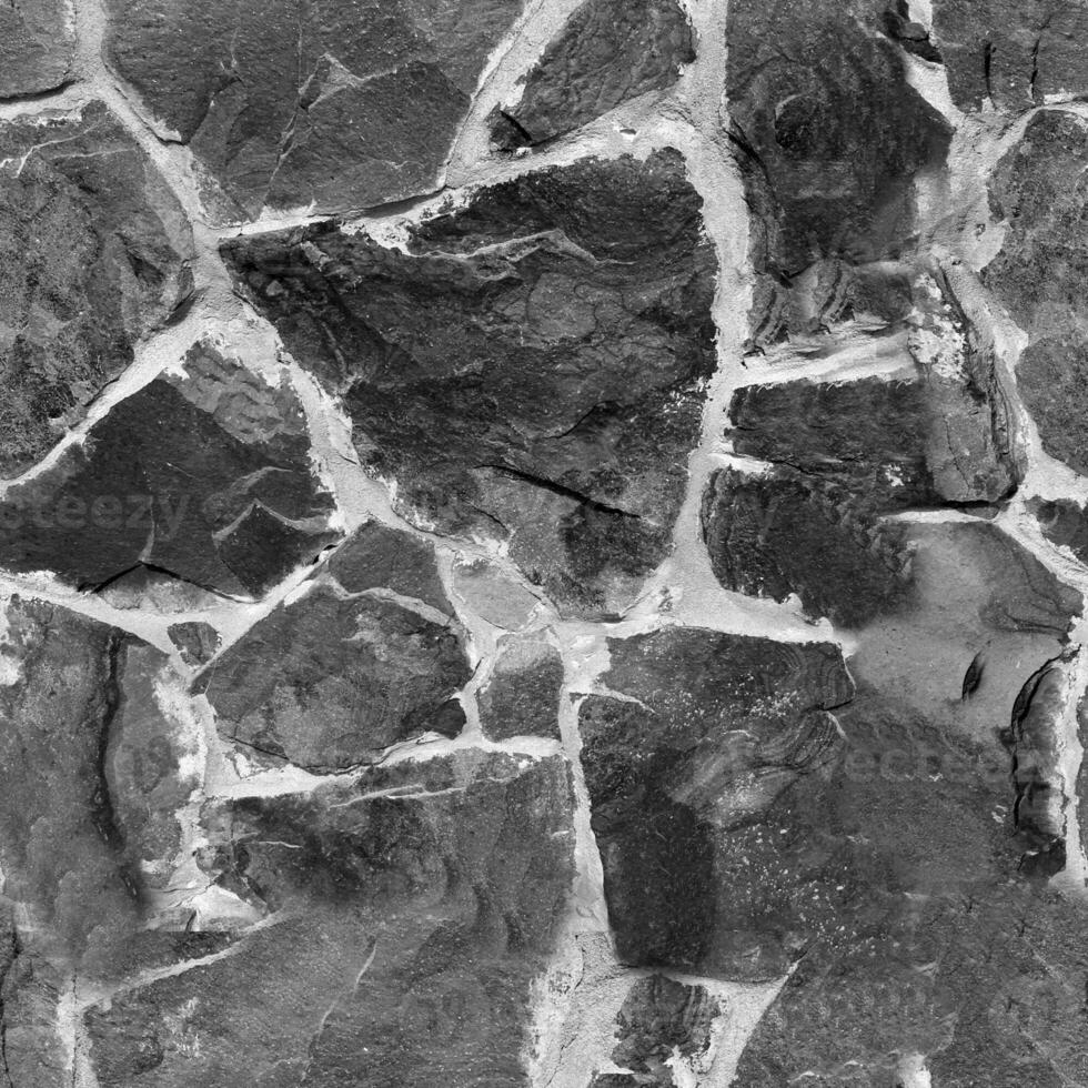 Seamless stone pattern. Old stone wall black and white monochrome texture photo