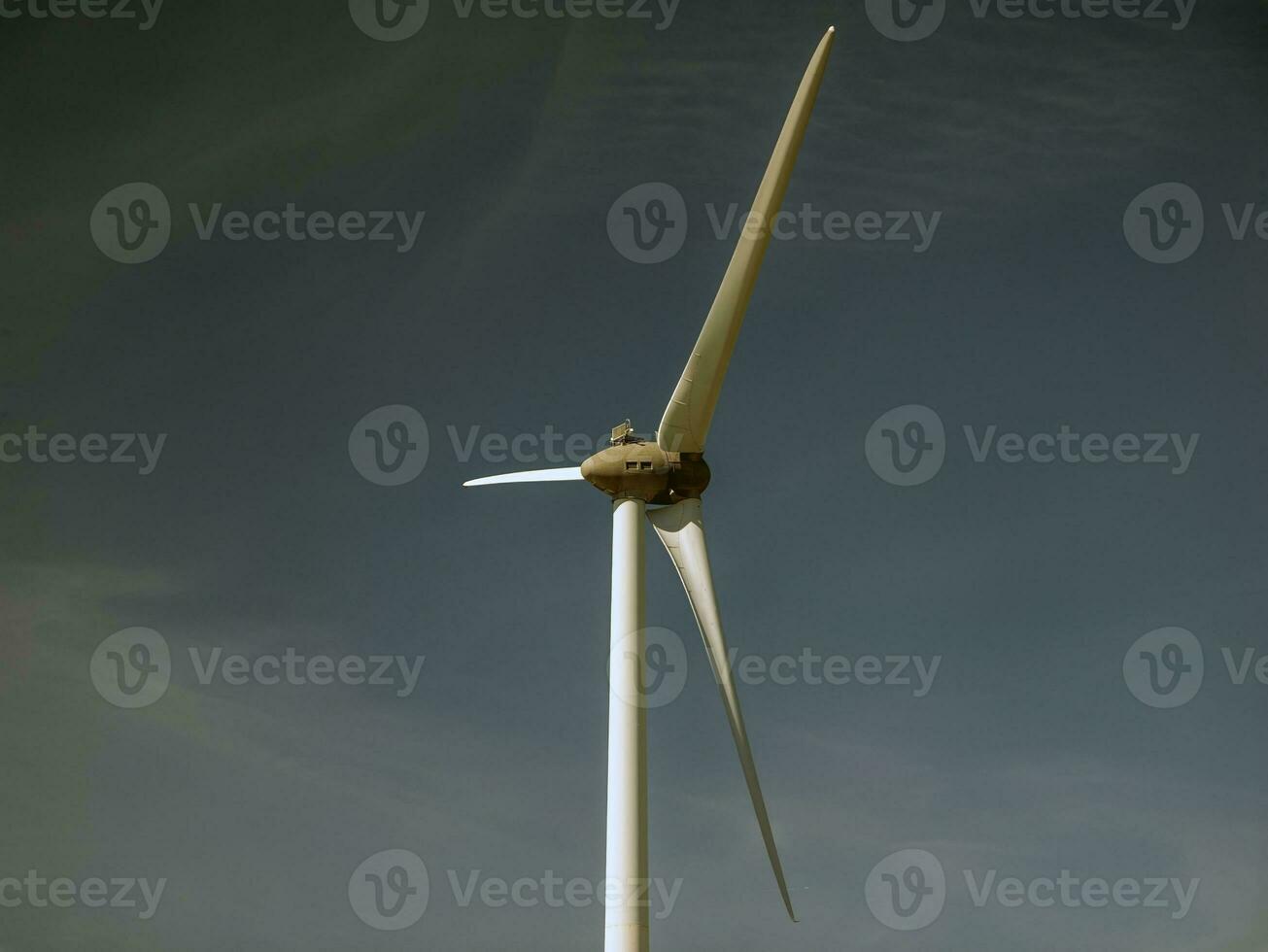 Wind power plant rotor close view. Windpower generator. Green energy concept photo