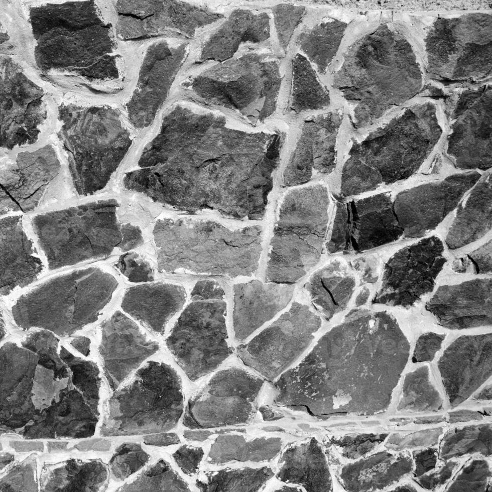 Seamless stone pattern. Old stone wall black and white monochrome texture photo