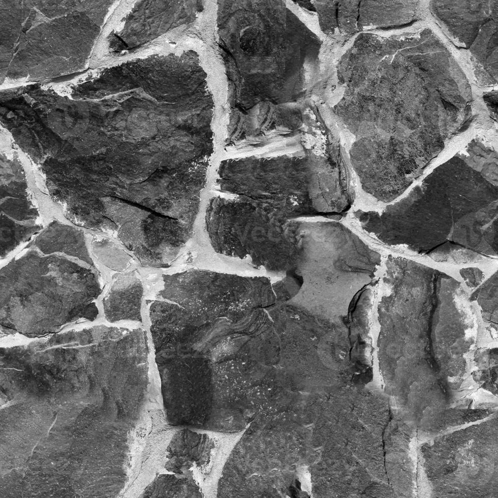 Seamless stone pattern. Old stone wall black and white monochrome texture photo