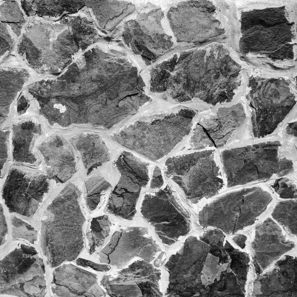 Seamless stone pattern. Old stone wall black and white monochrome texture photo