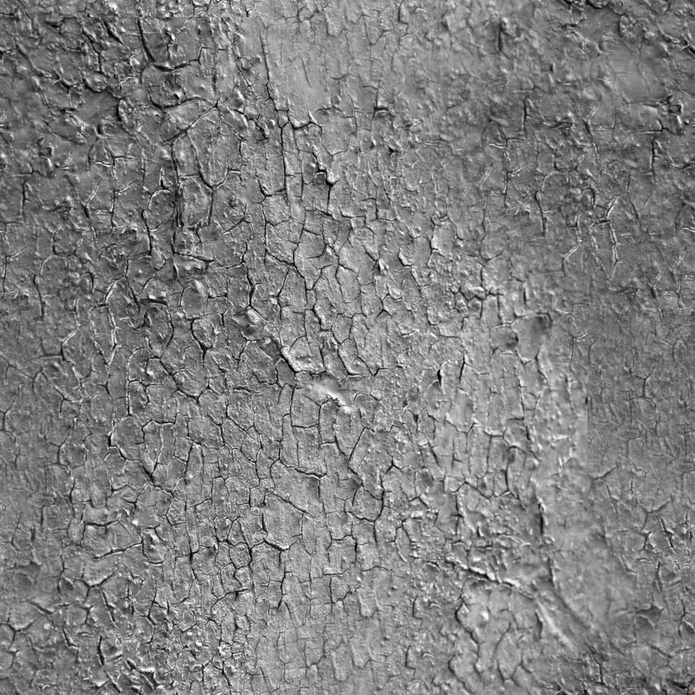 Cracked plaster texture. Old plastering pattern black and white monochrome background photo