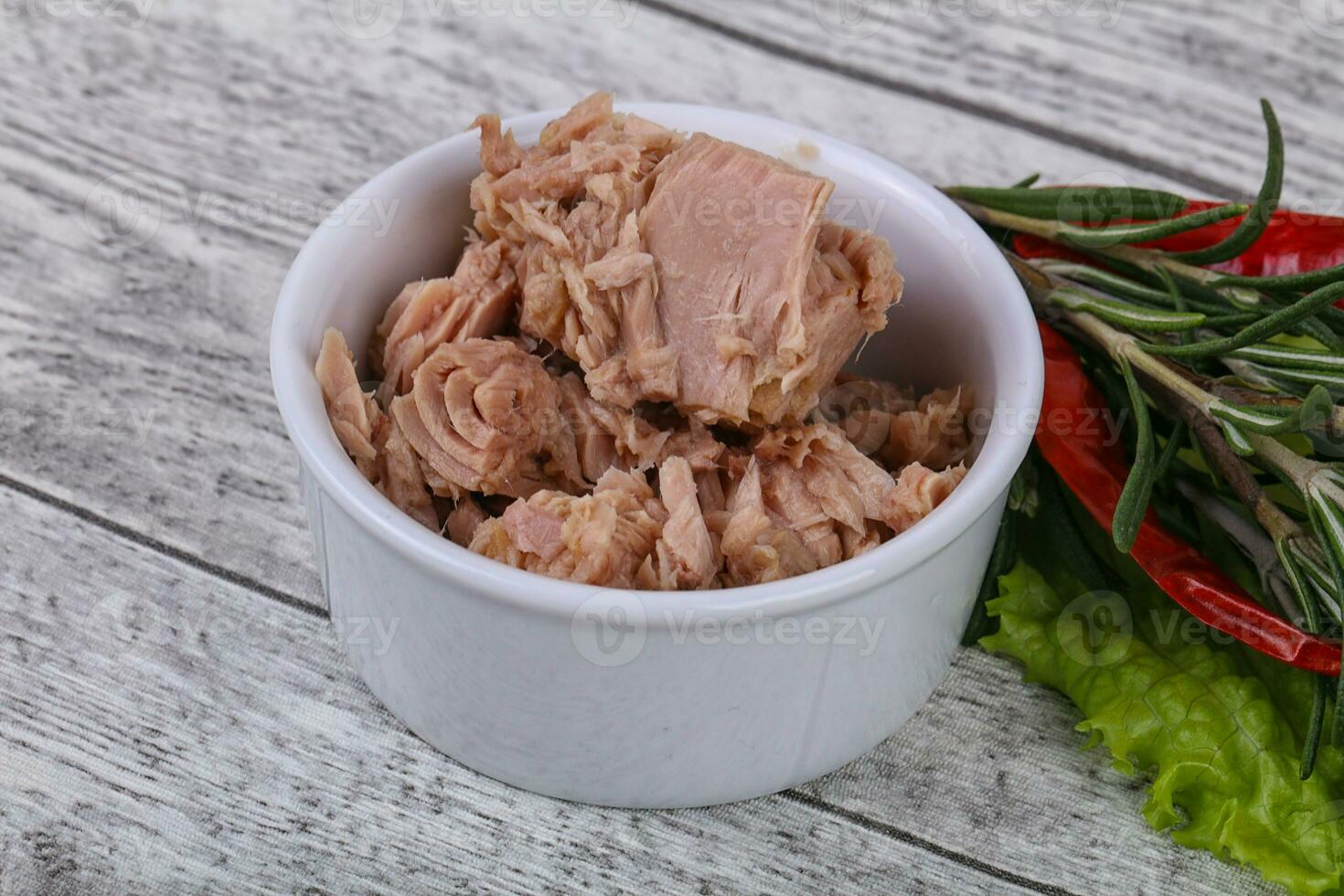 Tasty canned tuna fish in the bowl photo