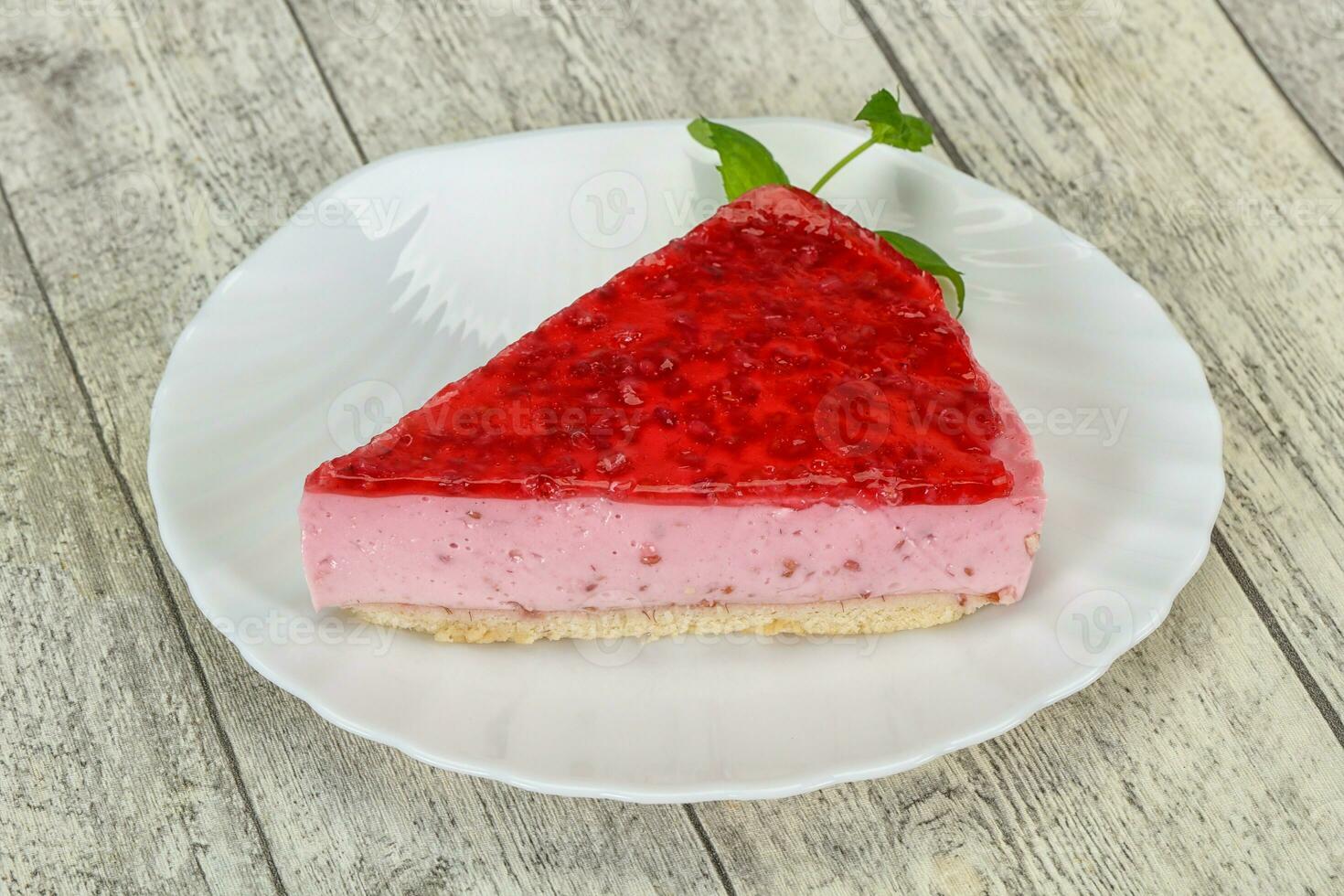 Soft Raspberry cheesecake served mint photo