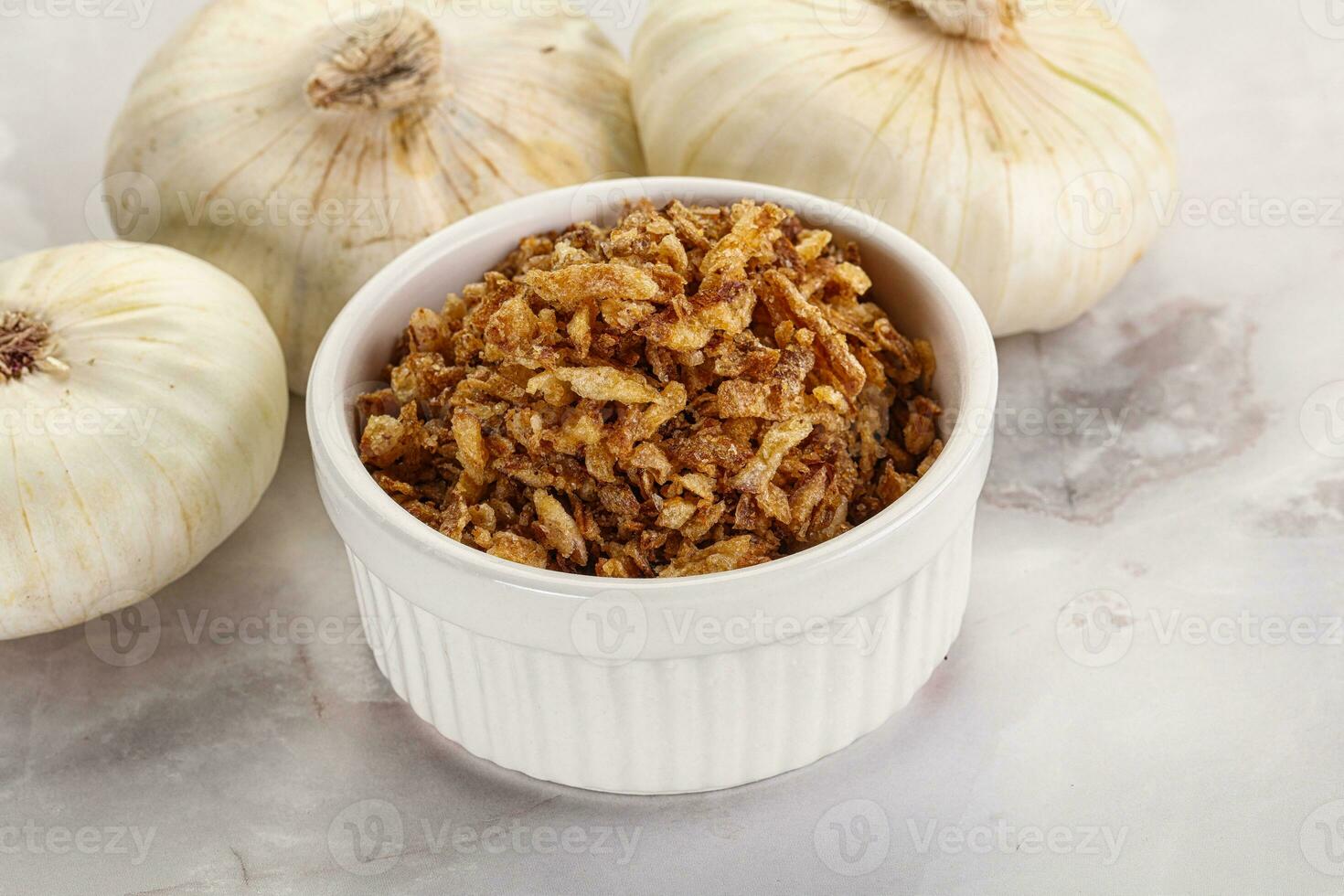 Dried roasted onion flakes for culinary photo